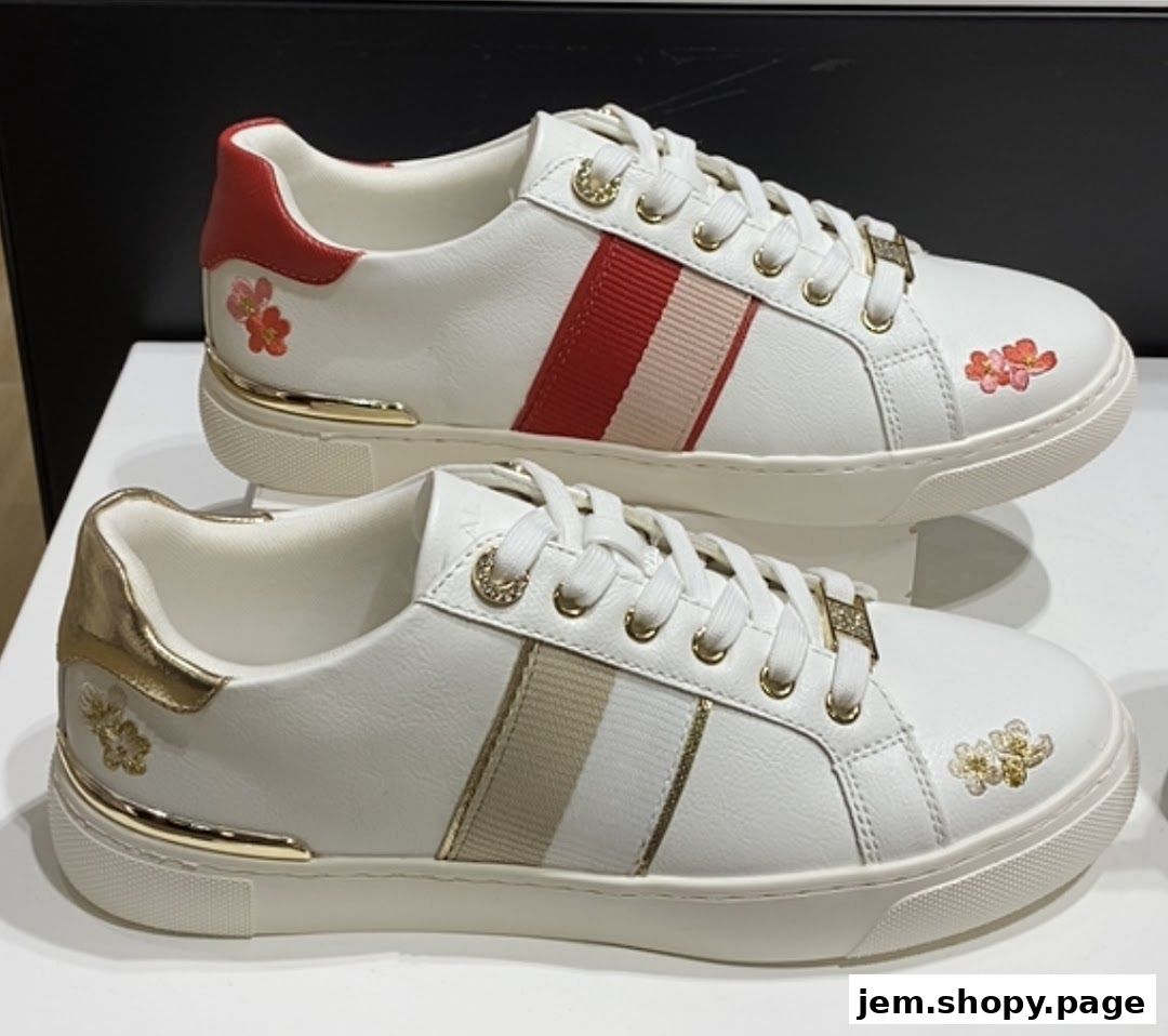 Two pairs of white sneakers with floral embroidery and striped accents.