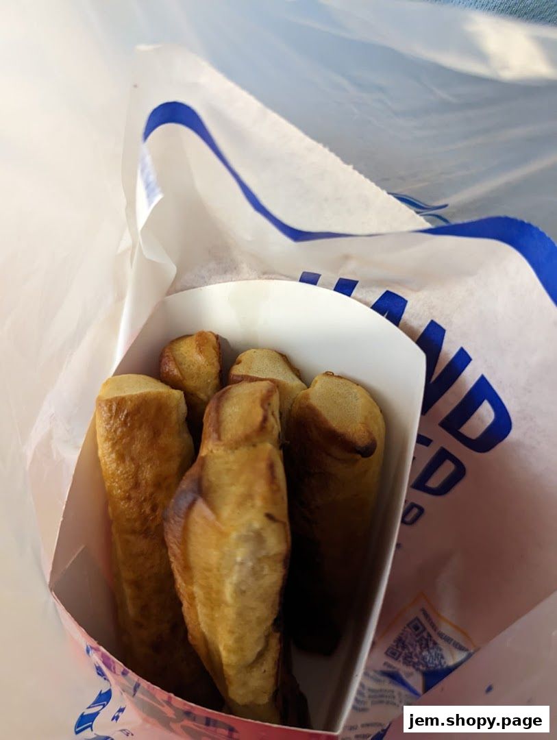A bag filled with golden-brown pretzel bites from Auntie Anne's.