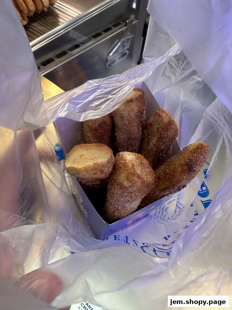 A box of cinnamon sugar pretzel bites in a plastic bag from Auntie Anne's.