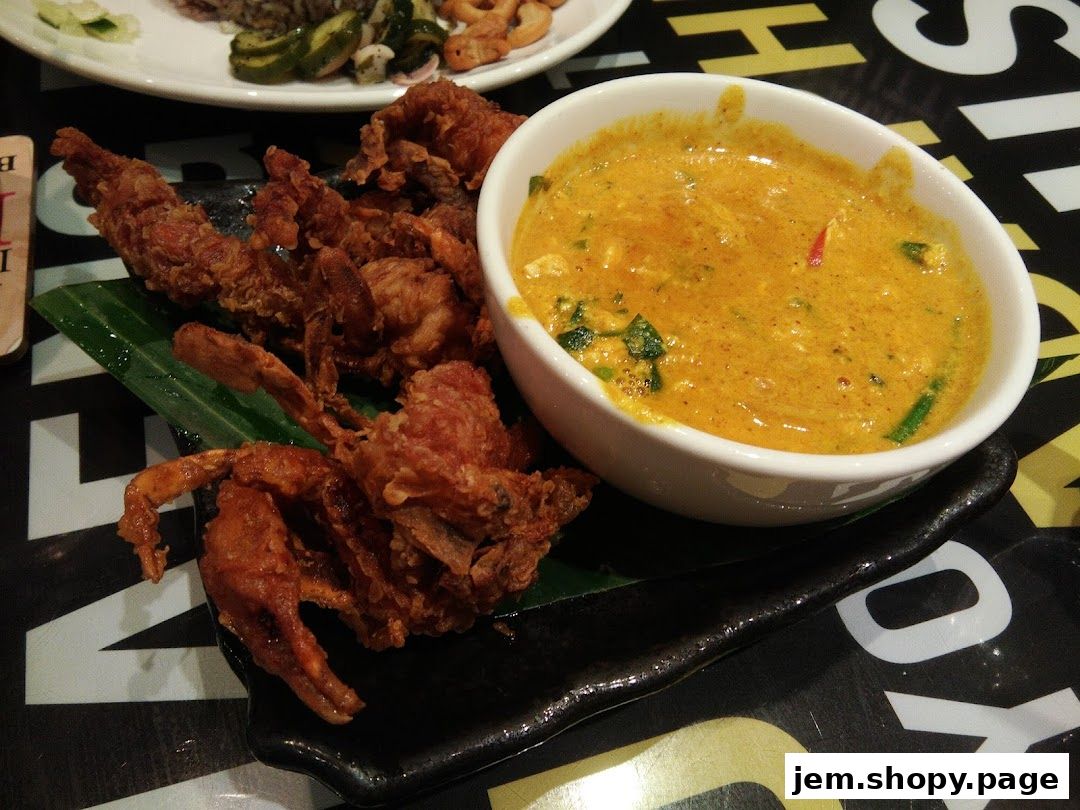 Crispy fried soft shell crab served with a rich, creamy curry sauce.