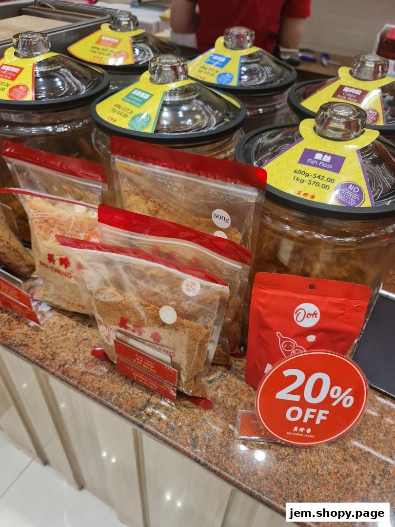 Bee Cheng Hiang shop display featuring various meat floss products and a 20% off promotion.