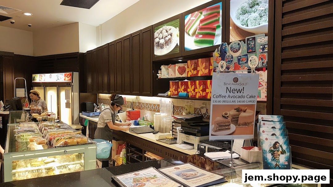 Interior view of Bengawan Solo shop with display cases and staff serving customers.