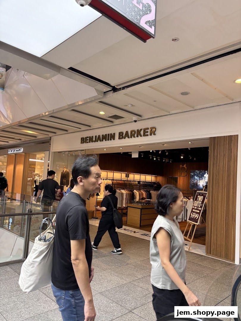 Benjamin Barker store entrance with clothing displays and a promotional sign.