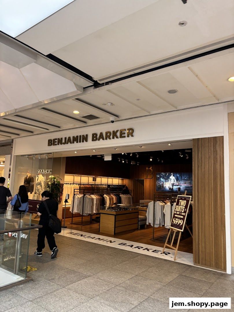 Benjamin Barker store entrance showcasing men's suits and shirts with a promotional sign.