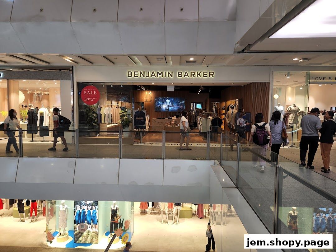 Benjamin Barker store entrance with clothing displays and shoppers.