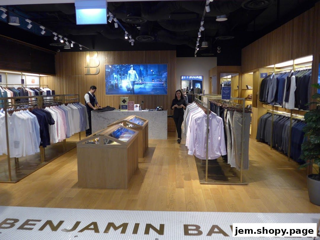 Interior of Benjamin Barker store showcasing men's shirts, suits, and accessories.
