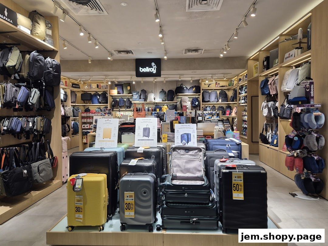 Interior view of a luggage and backpack store showcasing various travel bags and suitcases.