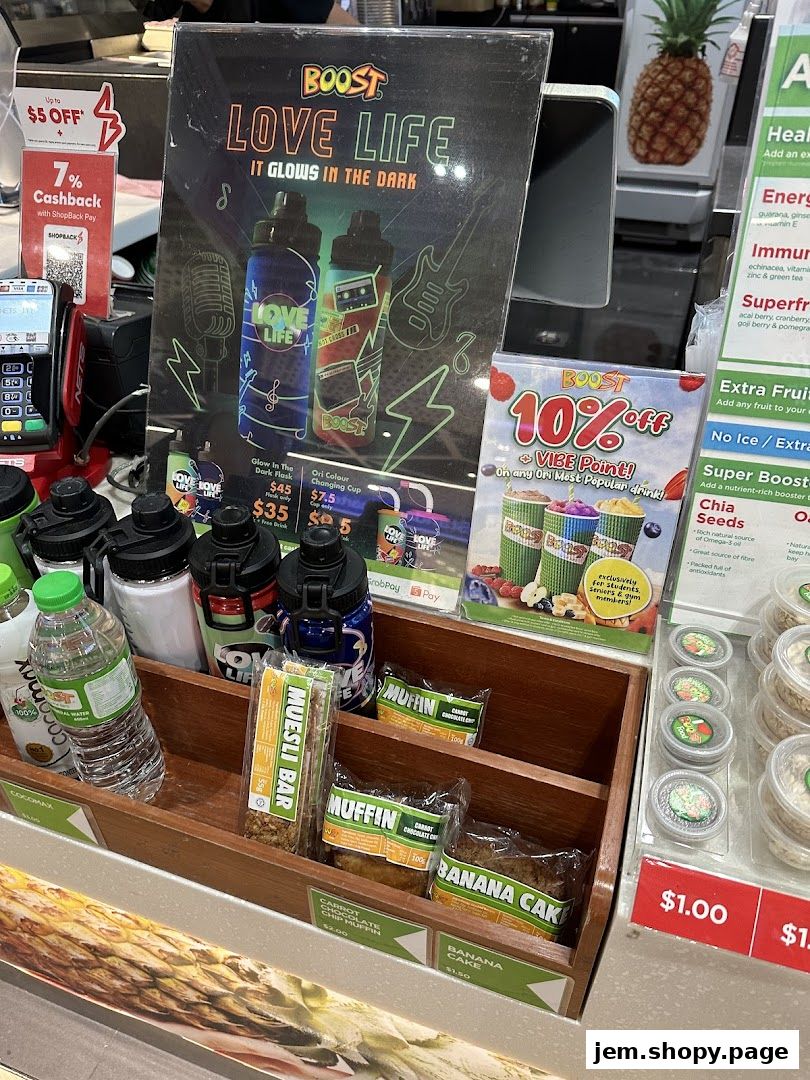 Boost Juice JEM shop display featuring drinks, snacks, and promotional materials.