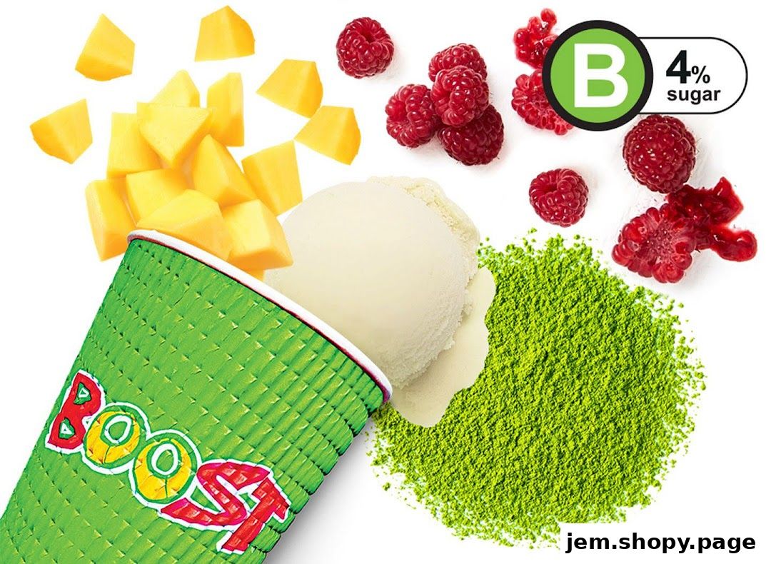 A Boost Juice cup with mango, ice cream, raspberries, and matcha powder.