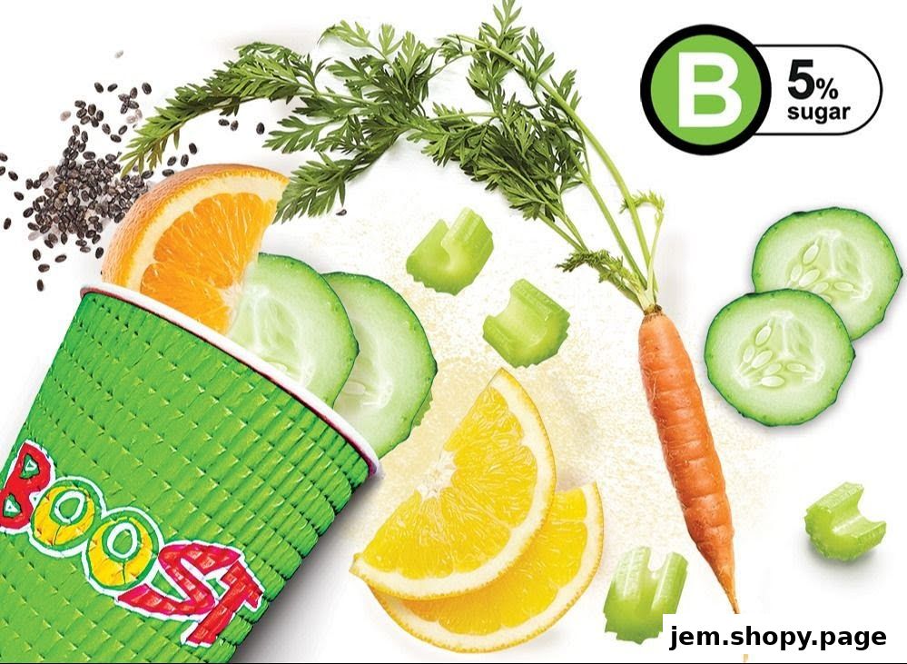 A cup of Boost Juice with fresh oranges, cucumbers, carrots, celery, and chia seeds.