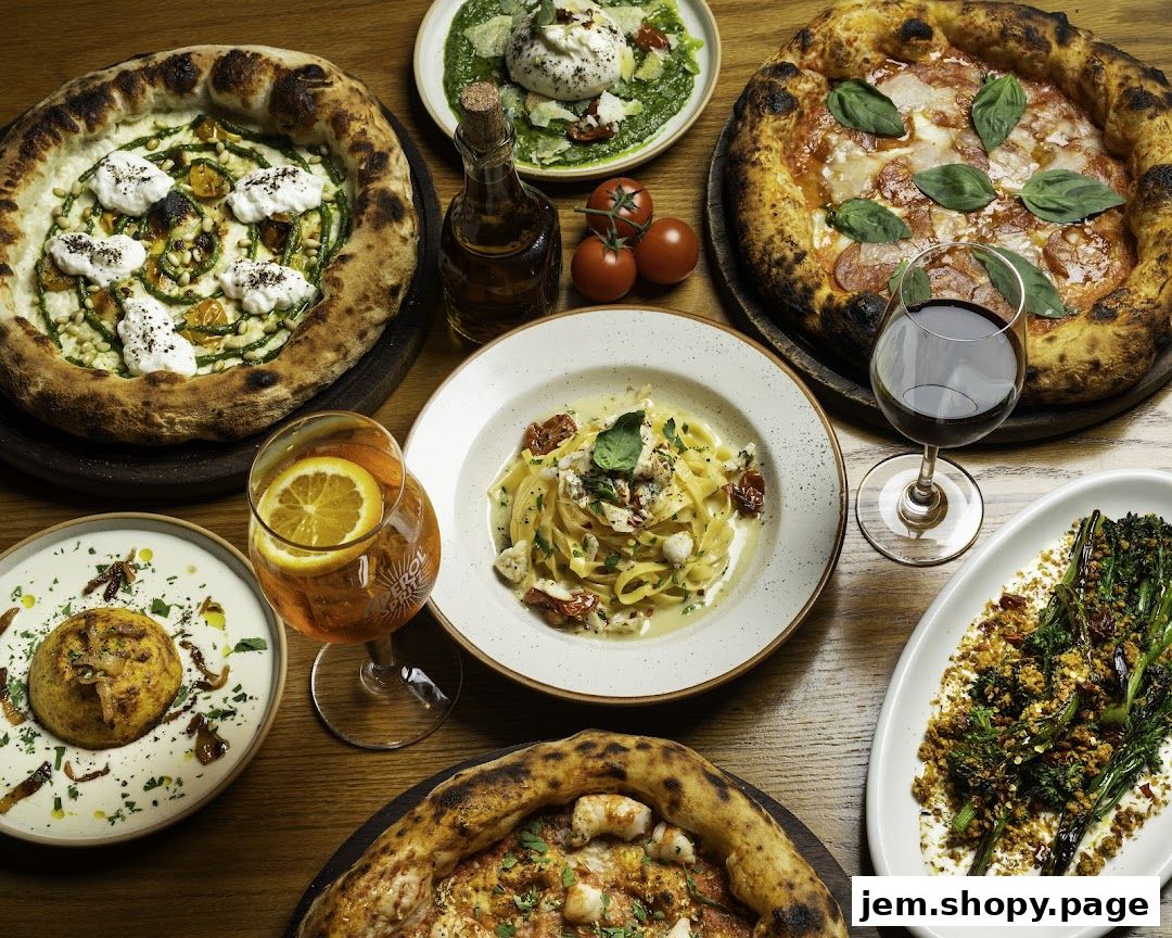 A spread of delicious Italian food including pizzas, pasta, and appetizers.