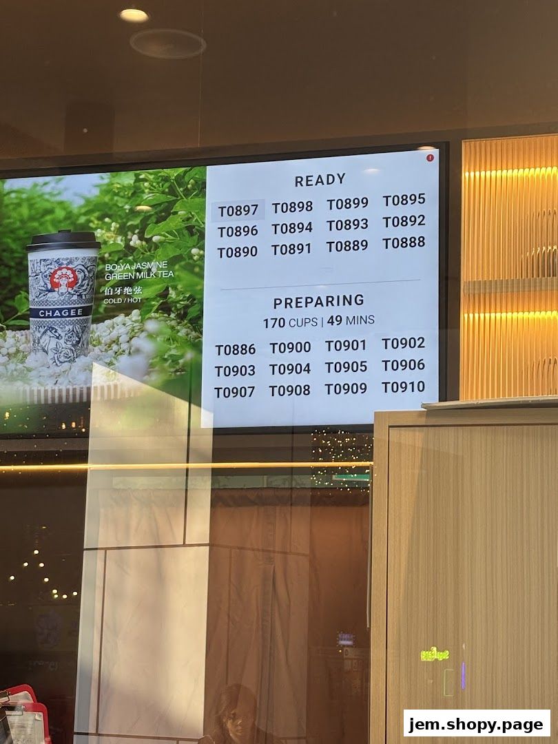 A digital display showing order numbers ready and preparing at CHAGEE.