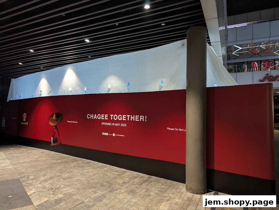 A red hoarding announces the upcoming opening of Chagee Together in May 2025.