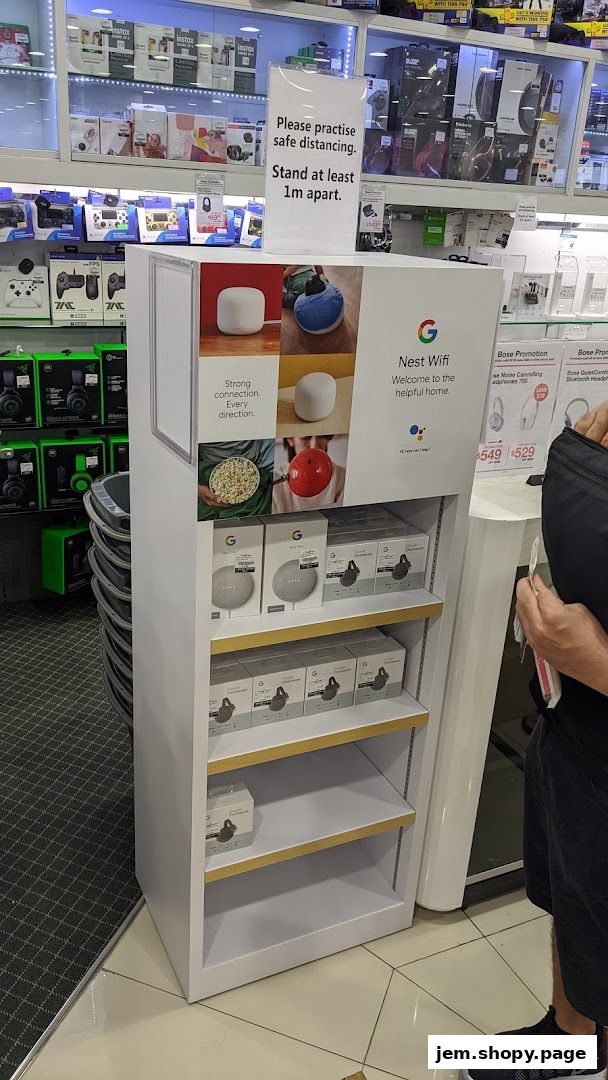 A display stand showcasing Google Nest Wifi and Google Chromecast products at Challenger.