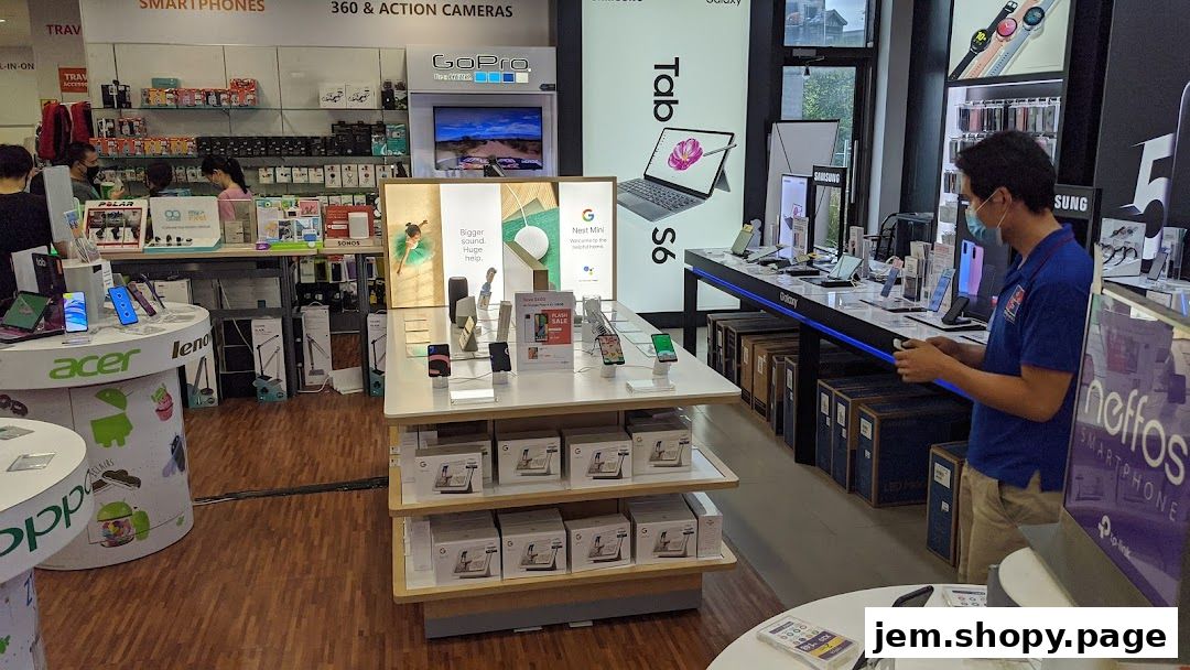 Interior view of a Challenger electronics store showcasing smartphones, tablets, and accessories.