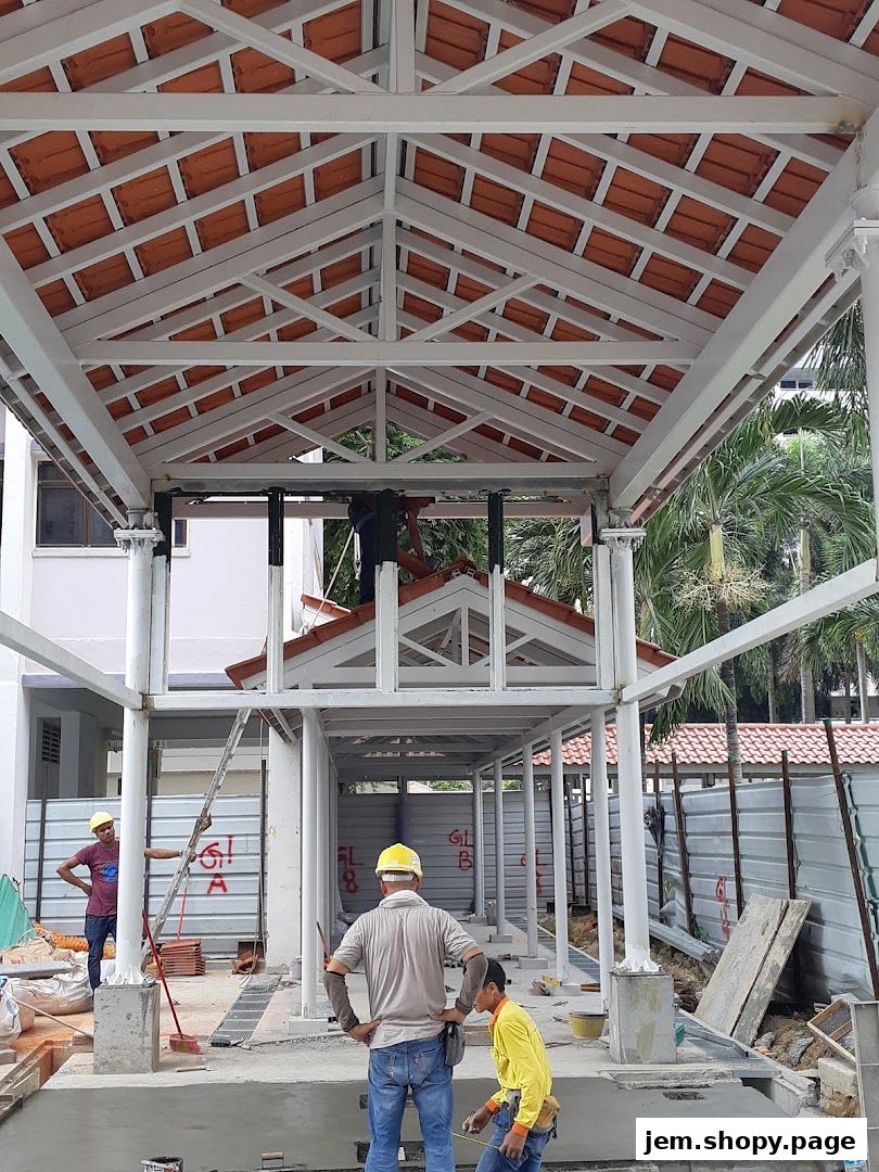 Construction workers are building a covered walkway with a tiled roof.