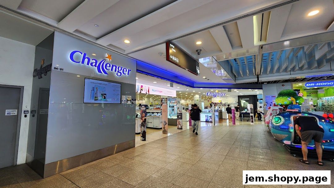The exterior of the Challenger electronics store with its prominent signage and displays.