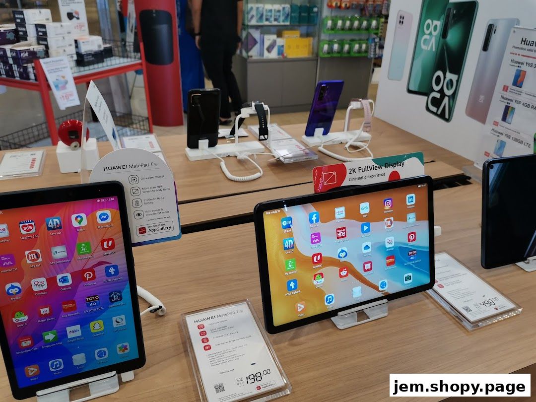 Display of Huawei tablets and phones with promotional signage in a retail store.