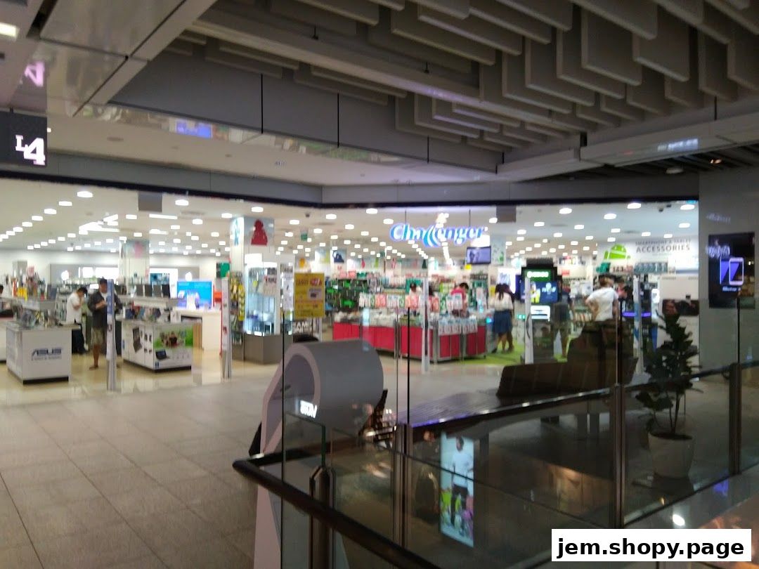 The exterior of the Challenger electronics store, showcasing various products and displays.