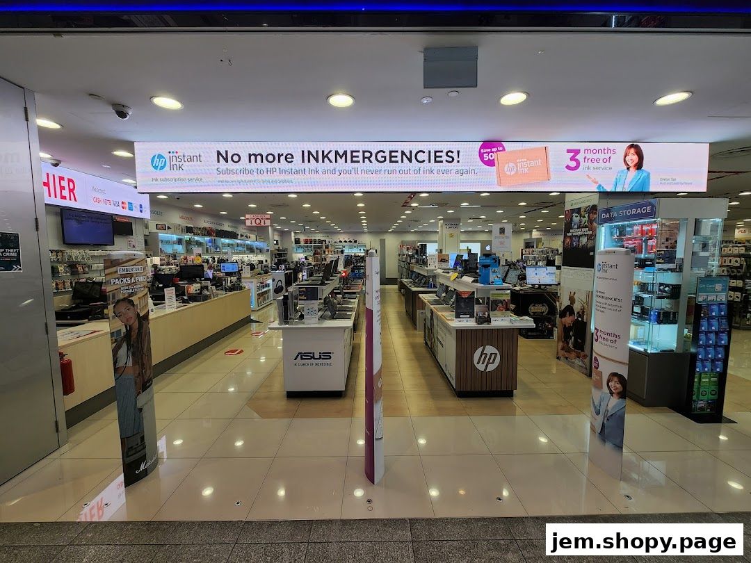 Interior view of Challenger JEM electronics store showcasing various products and promotions.