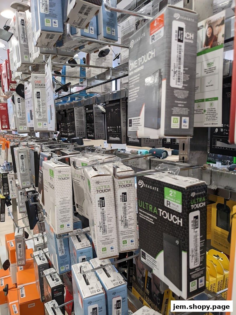 A retail display of Seagate external hard drives and storage devices.