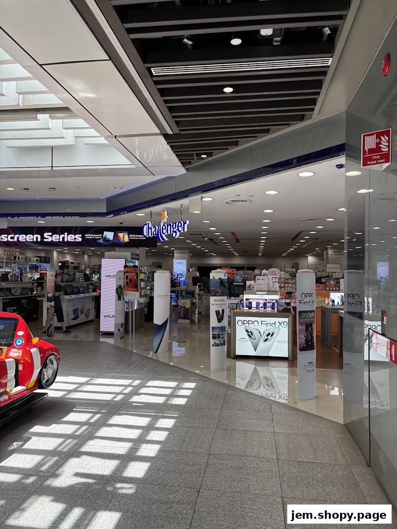 Interior view of the Challenger electronics store with various displays and products.