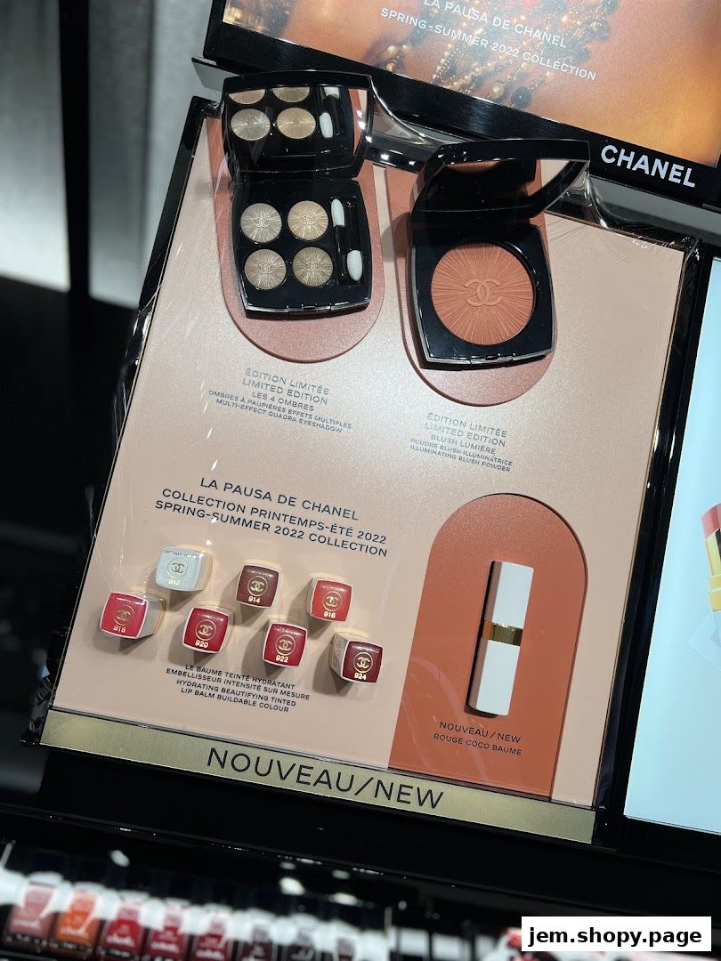 Chanel makeup display featuring eyeshadow, blush, and lip balm from the Spring-Summer 2022 collection.