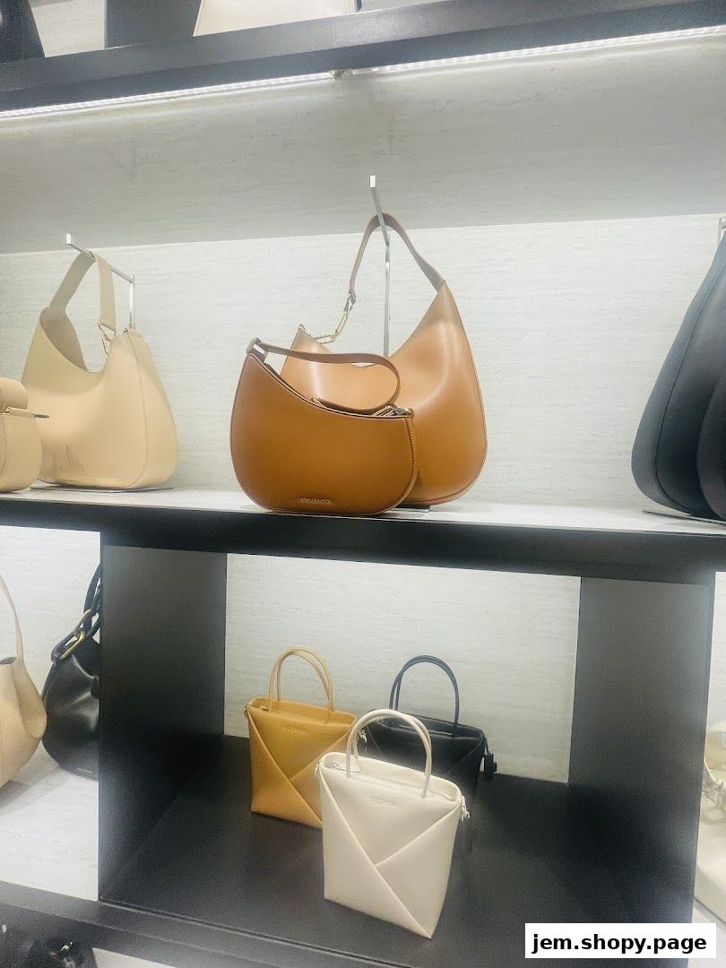 A display of various CHARLES & KEITH handbags in different styles and colors.