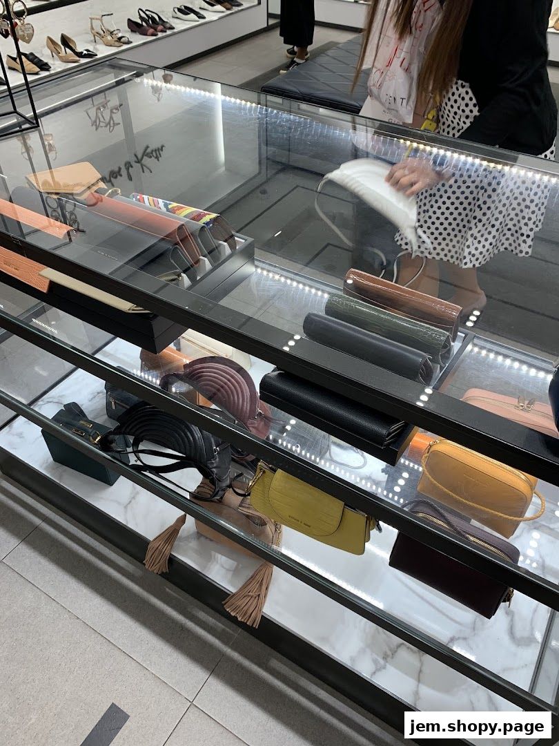 Interior view of a Charles & Keith store showcasing handbags and wallets in display cases.