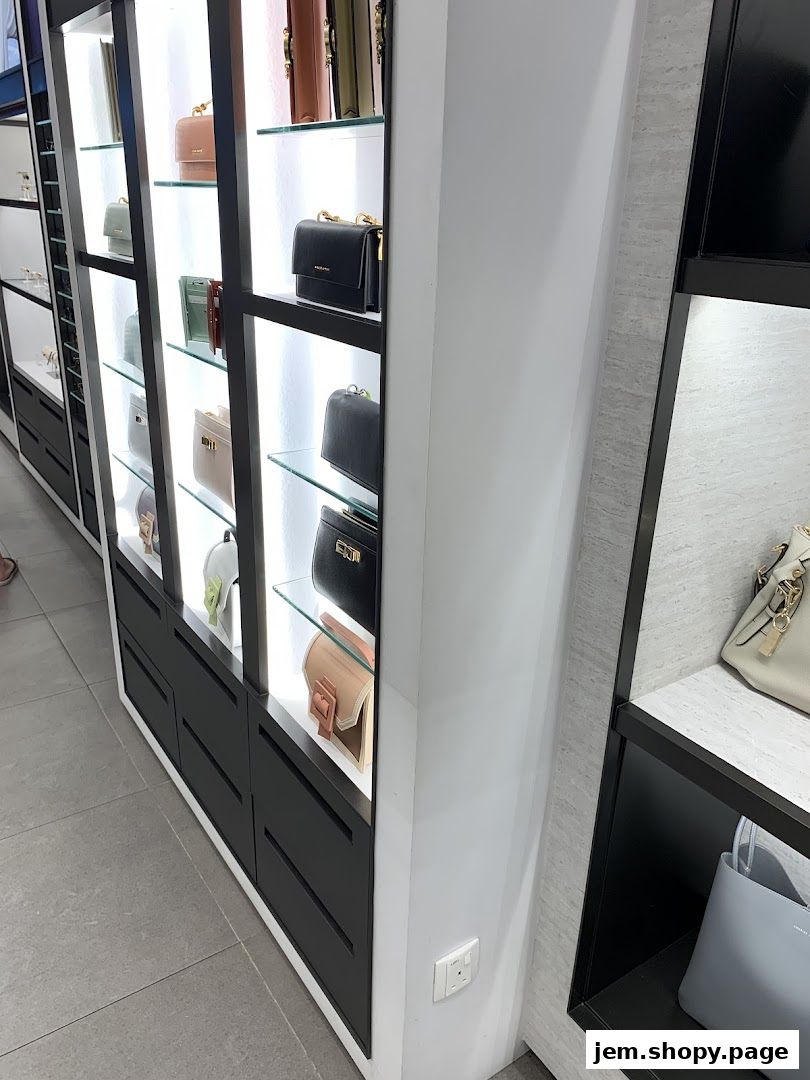 Display shelves showcasing various handbags and wallets from Charles Keith.