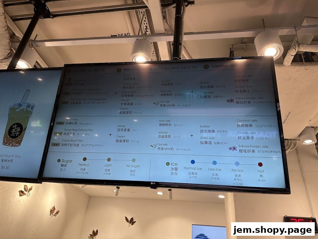 A digital menu board displaying various bubble tea options, toppings, and customization choices.
