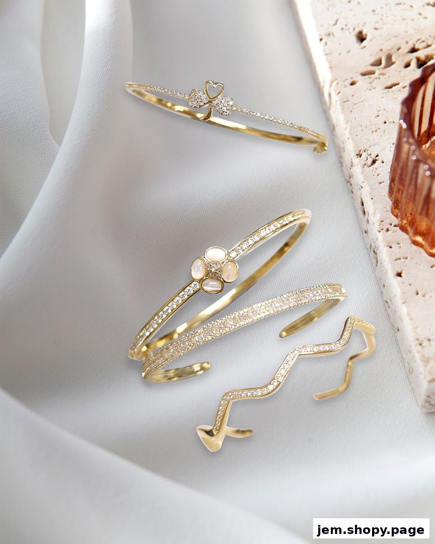 Elegant gold bracelets and a ring adorned with sparkling diamonds and stones.