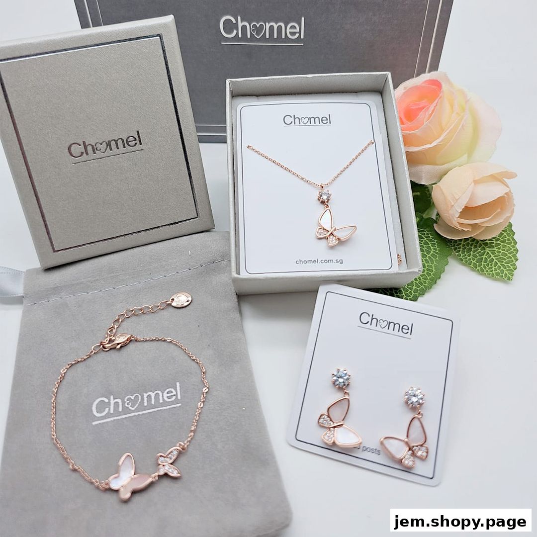 Chomel jewelry set featuring butterfly designs, including a necklace, bracelet, and earrings.