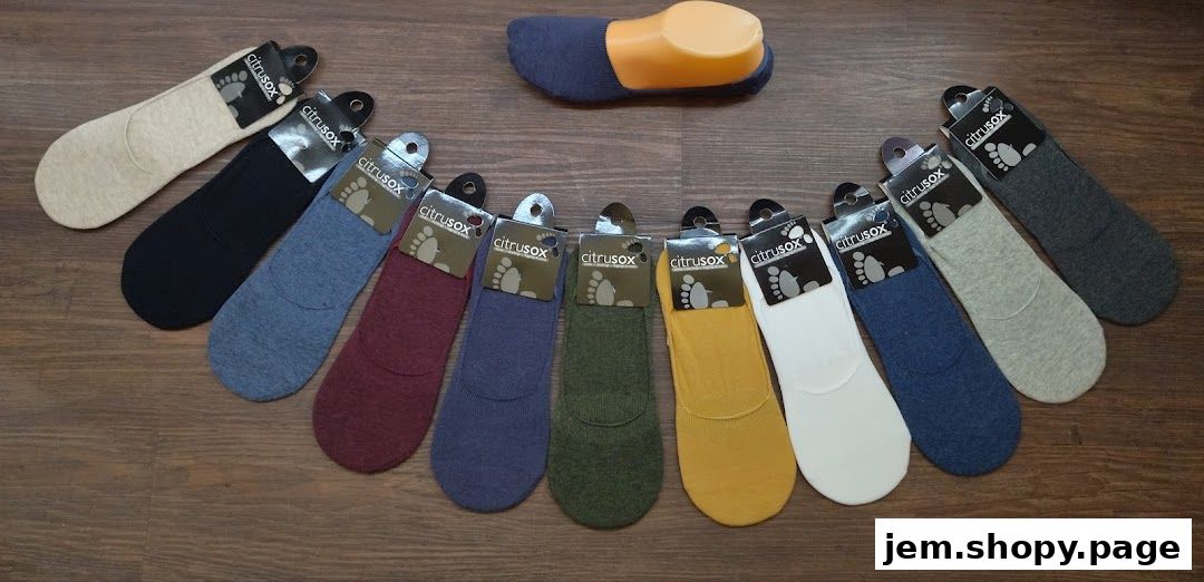 A collection of colorful no-show socks arranged in a semi-circle on a wooden surface.