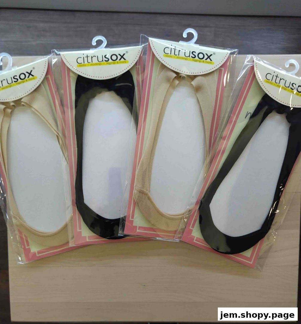 Four pairs of Citrusox no-show socks in beige and black packaging.