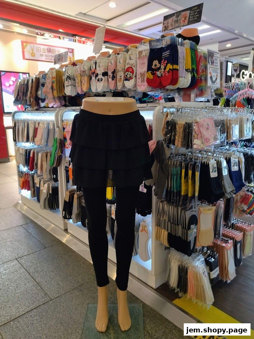 A mannequin displays a black skirt and leggings in a shop filled with socks.