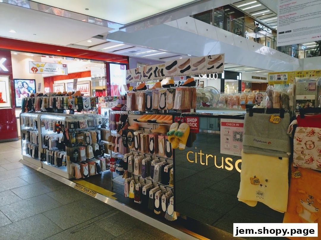 A retail shop display featuring a wide variety of socks and slippers, with the shop name 'Citrusox' visible.