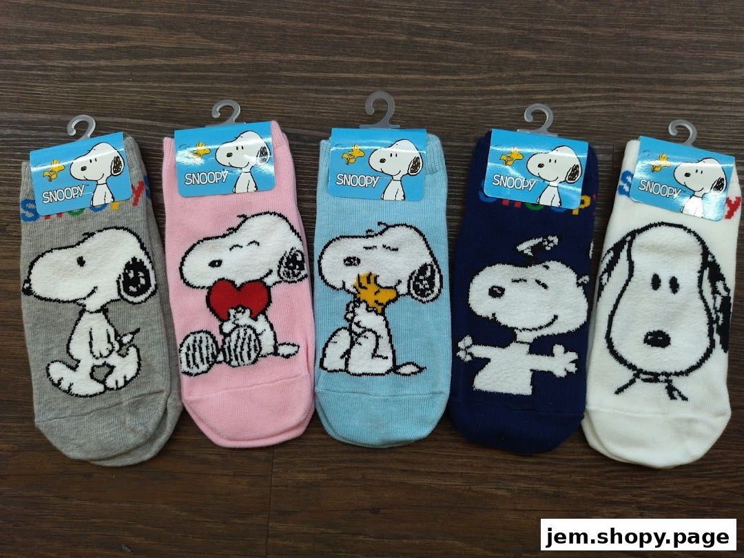 Five pairs of Snoopy-themed socks in various colors and designs.