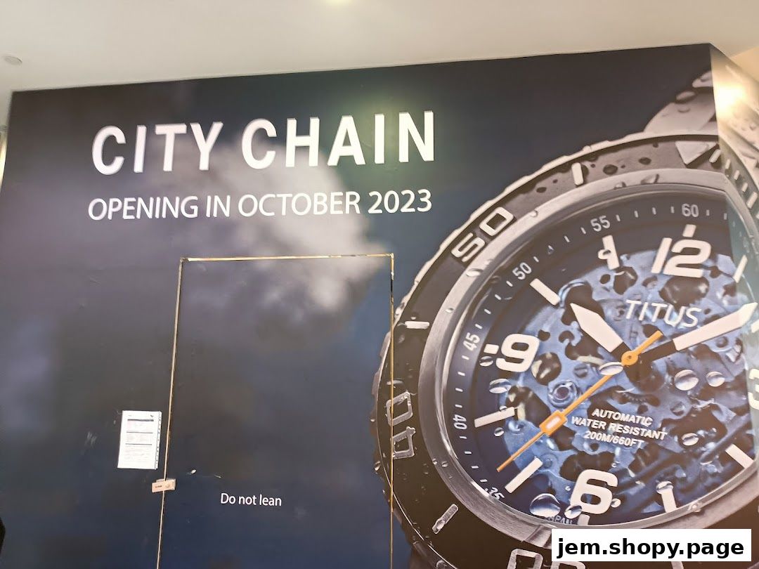 A large banner for City Chain, announcing their October 2023 opening with a watch advertisement.