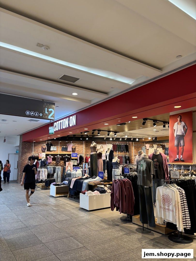 Interior view of a Cotton On store showcasing clothing displays and mannequins.