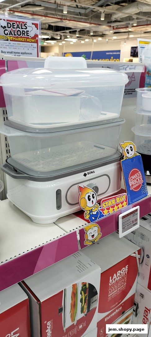 A stack of clear plastic steamers and a white electric steamer with cartoon mascots.