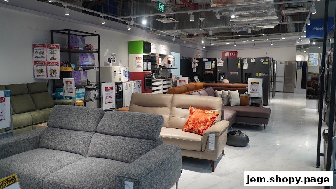 Interior view of a COURTS JEM store showcasing sofas and refrigerators.