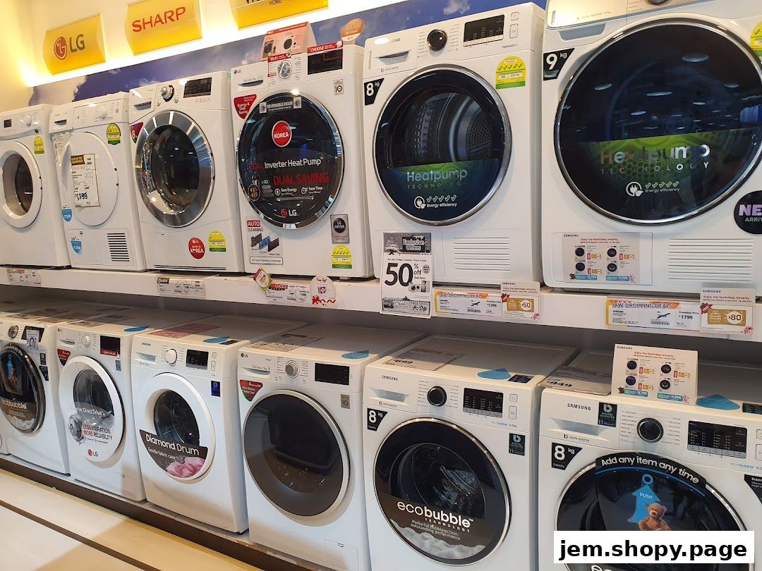 A display of various washing machines and dryers from brands like LG and Samsung.