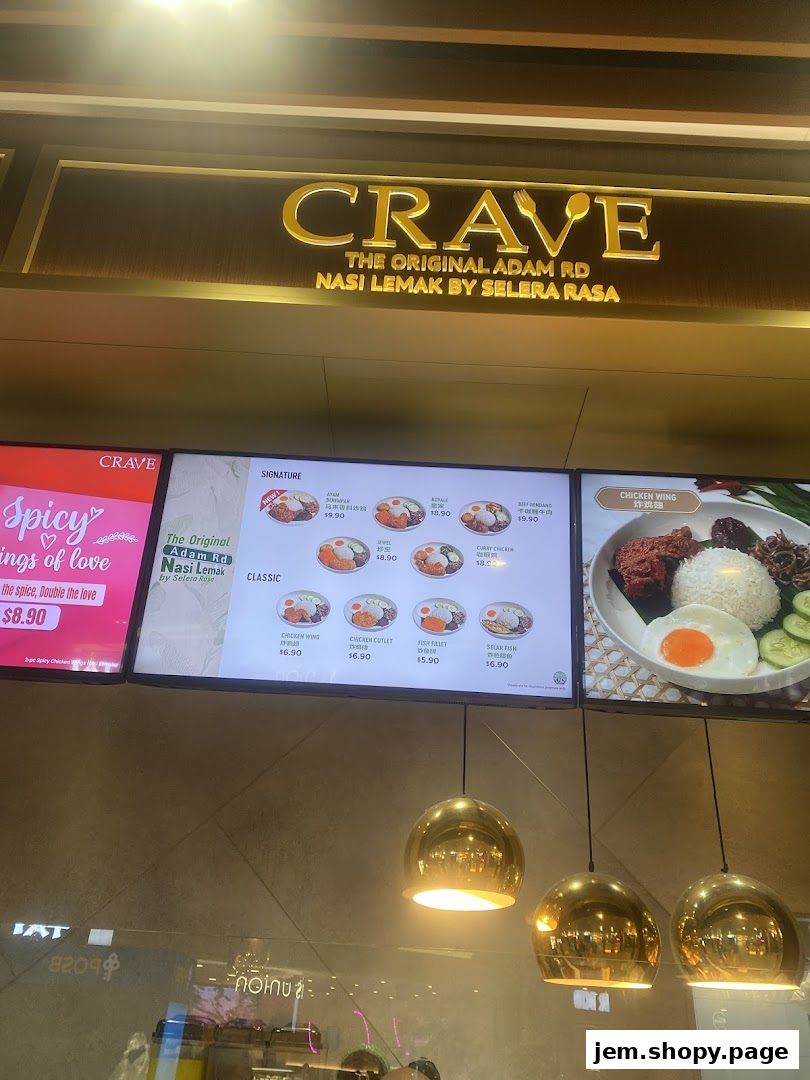 A digital menu board displaying Nasi Lemak dishes and prices from Crave.