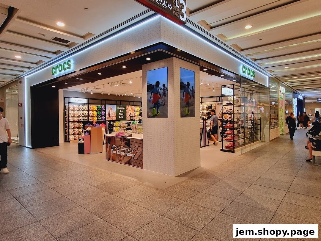 The Crocs store entrance displays a wide variety of colorful clogs and footwear.