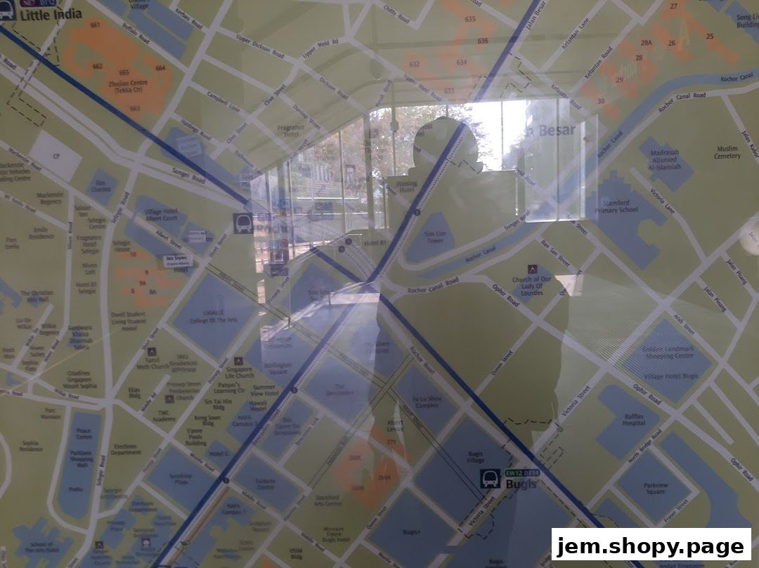 A map of Singapore with reflections of people and a building visible.