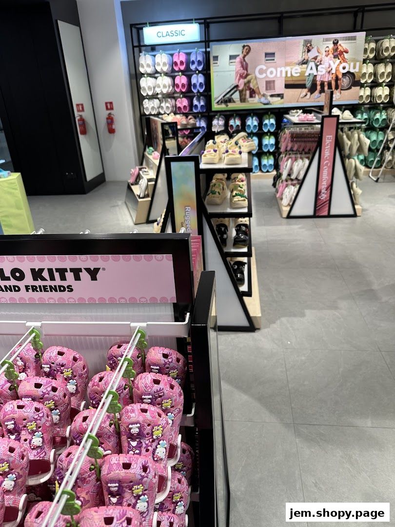 Interior view of a Crocs store showcasing various colorful footwear and Hello Kitty themed products.
