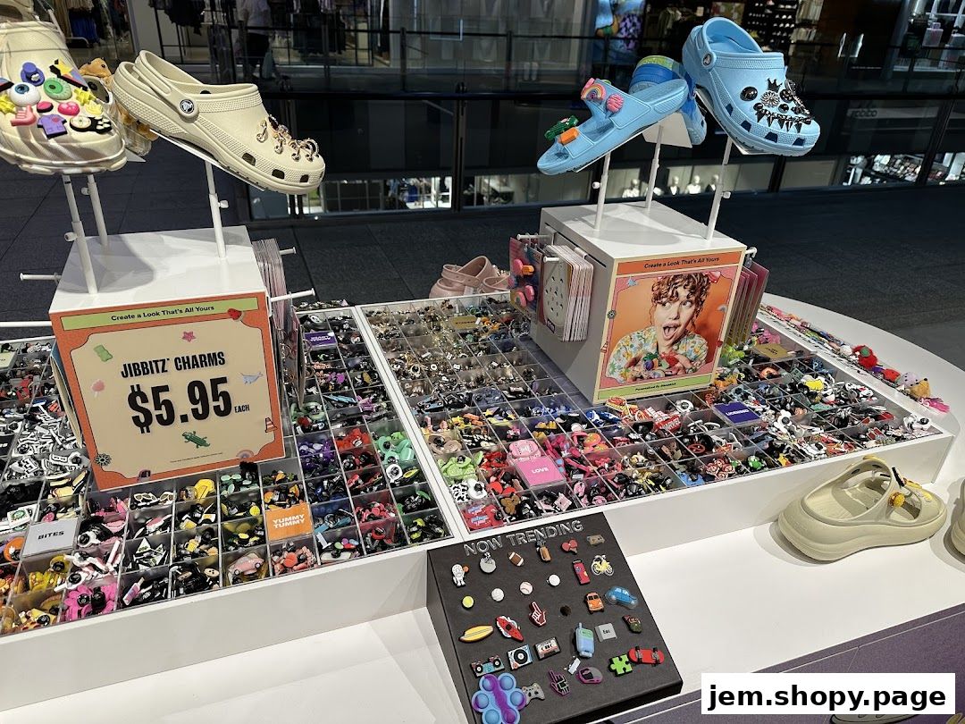 A display of Crocs shoes and a wide variety of Jibbitz charms for customization.