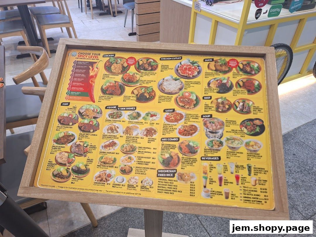 A menu board displaying various Indonesian dishes with prices and spice levels.