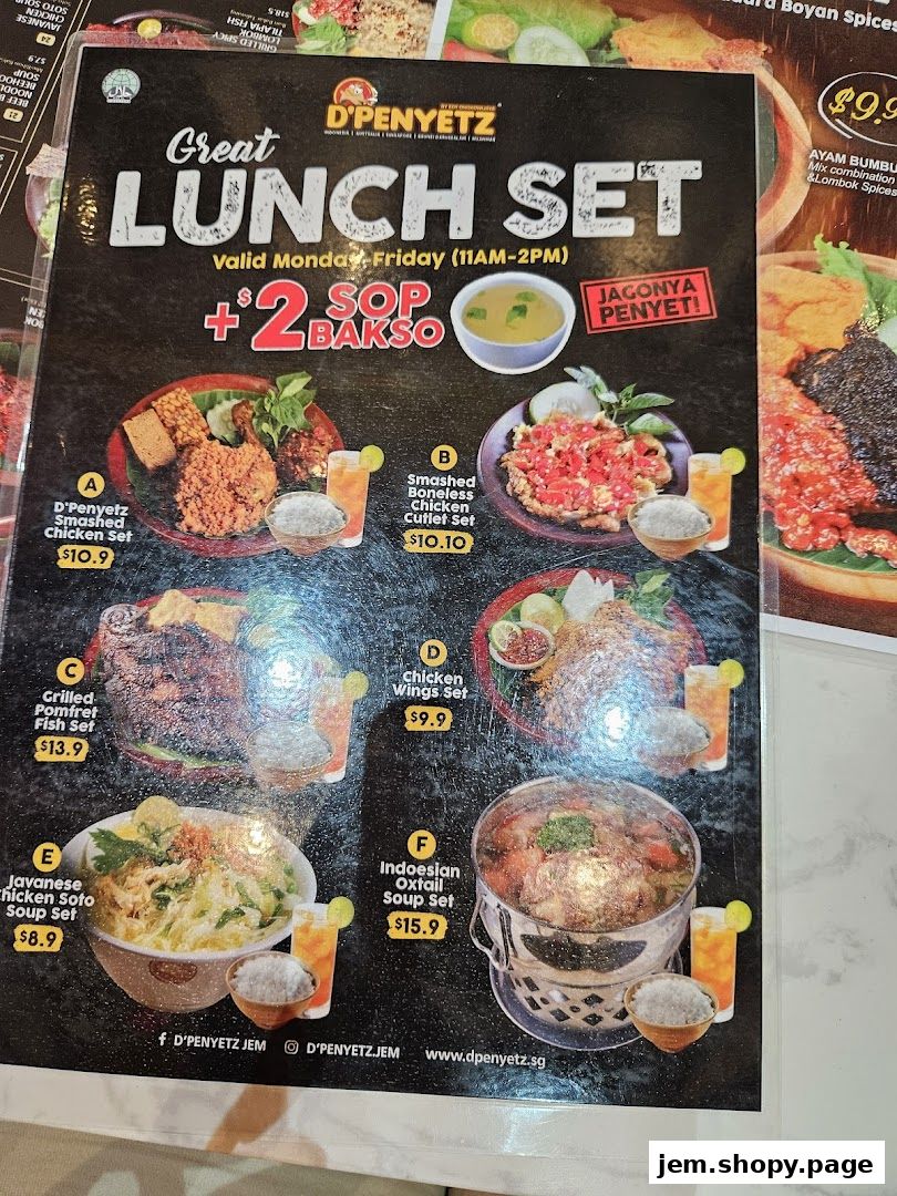 A menu showcasing lunch sets from D'Penyetz Jem, featuring various chicken, fish, and soup dishes.